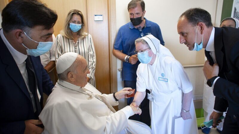 Pope Francis speaks with a nun at the Gemelli hospital, as he recovers following scheduled surgery on his colon, in Rome, Italy, July 11, 2021. Vatican Media/Handout via REUTERS ATTENTION EDITORS – THIS IMAGE WAS PROVIDED BY A THIRD PARTY.